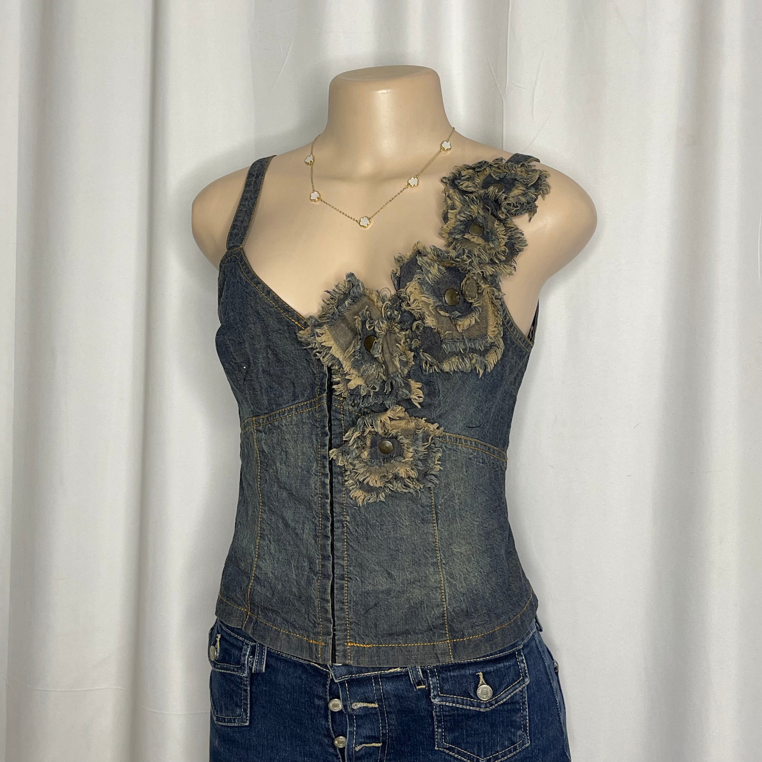 Distressed denim floral corset top with frayed rosette detailing