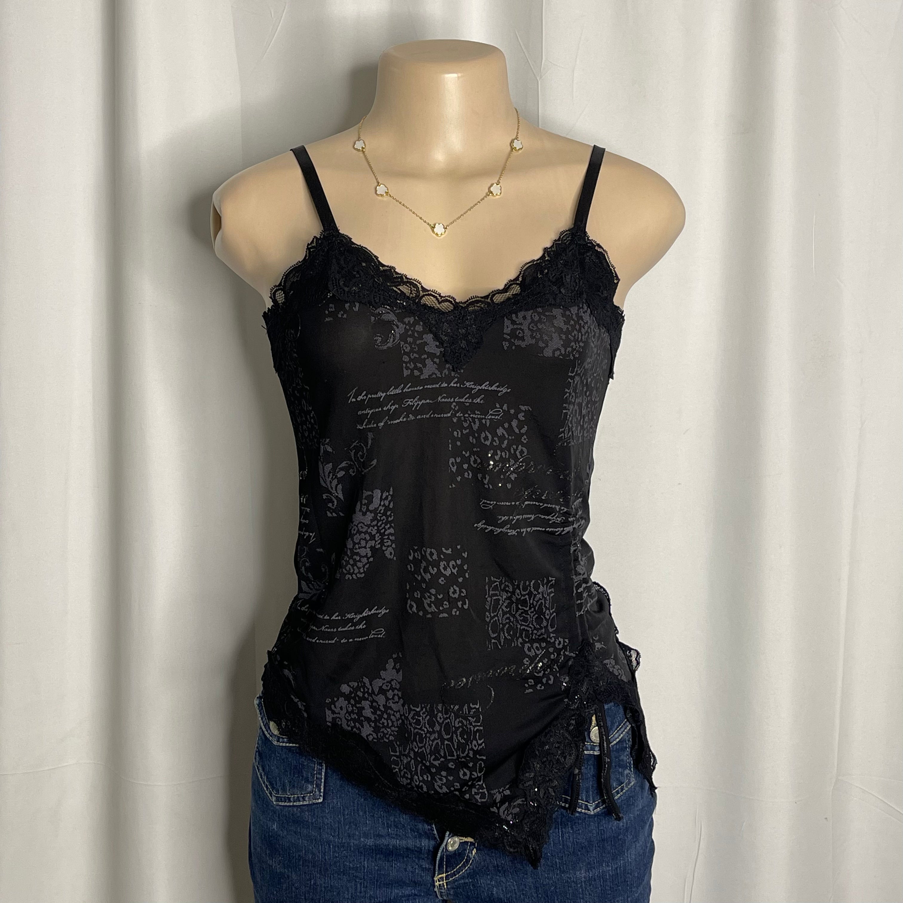 Black graphic camisole with lace trim and asymmetric hem