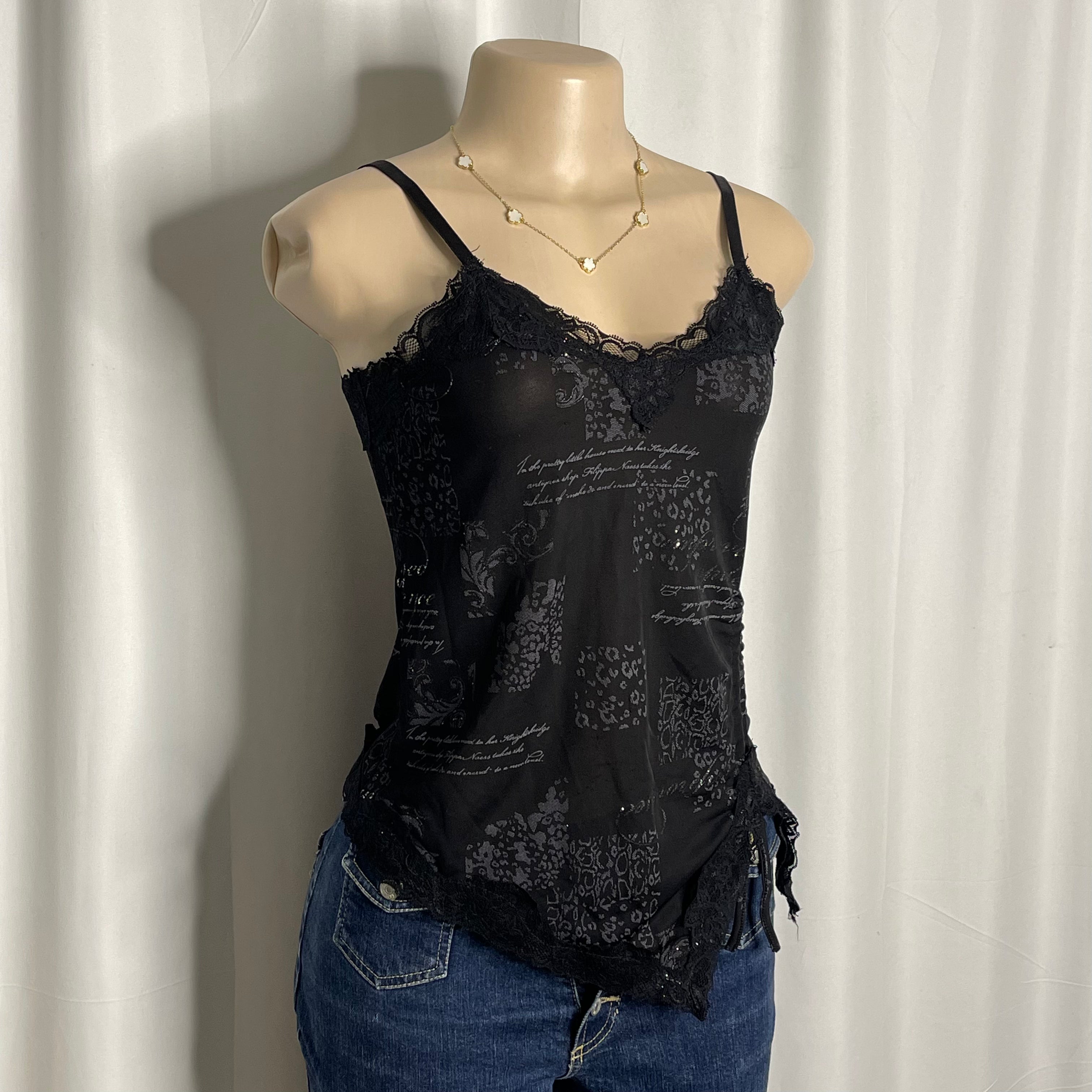 Black graphic camisole with lace trim and asymmetric hem