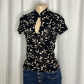 Chinese-style black embroidered mesh top and a keyhole cut out