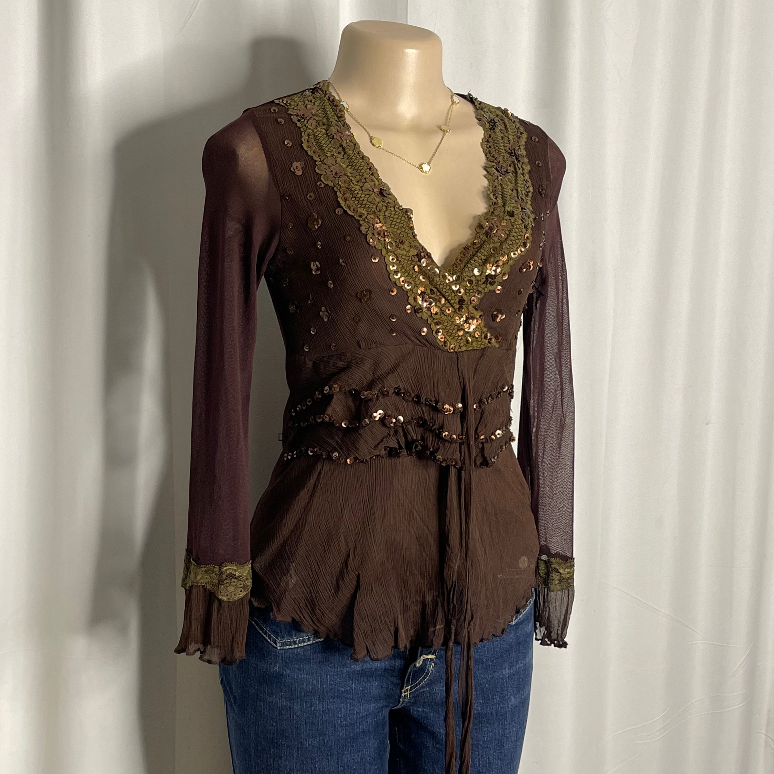 Y2K-style brown long sleeved top featuring intricate sequin embellishments v-neckline