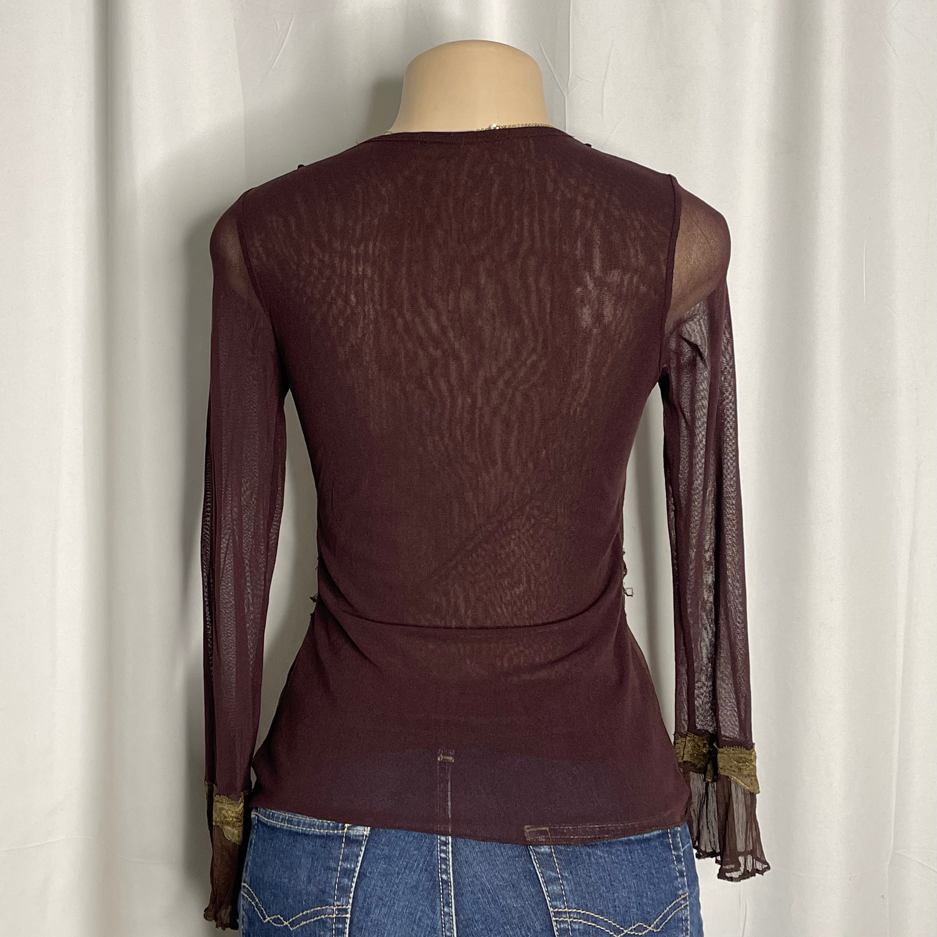 Y2K-style brown long sleeved top featuring intricate sequin embellishments v-neckline
