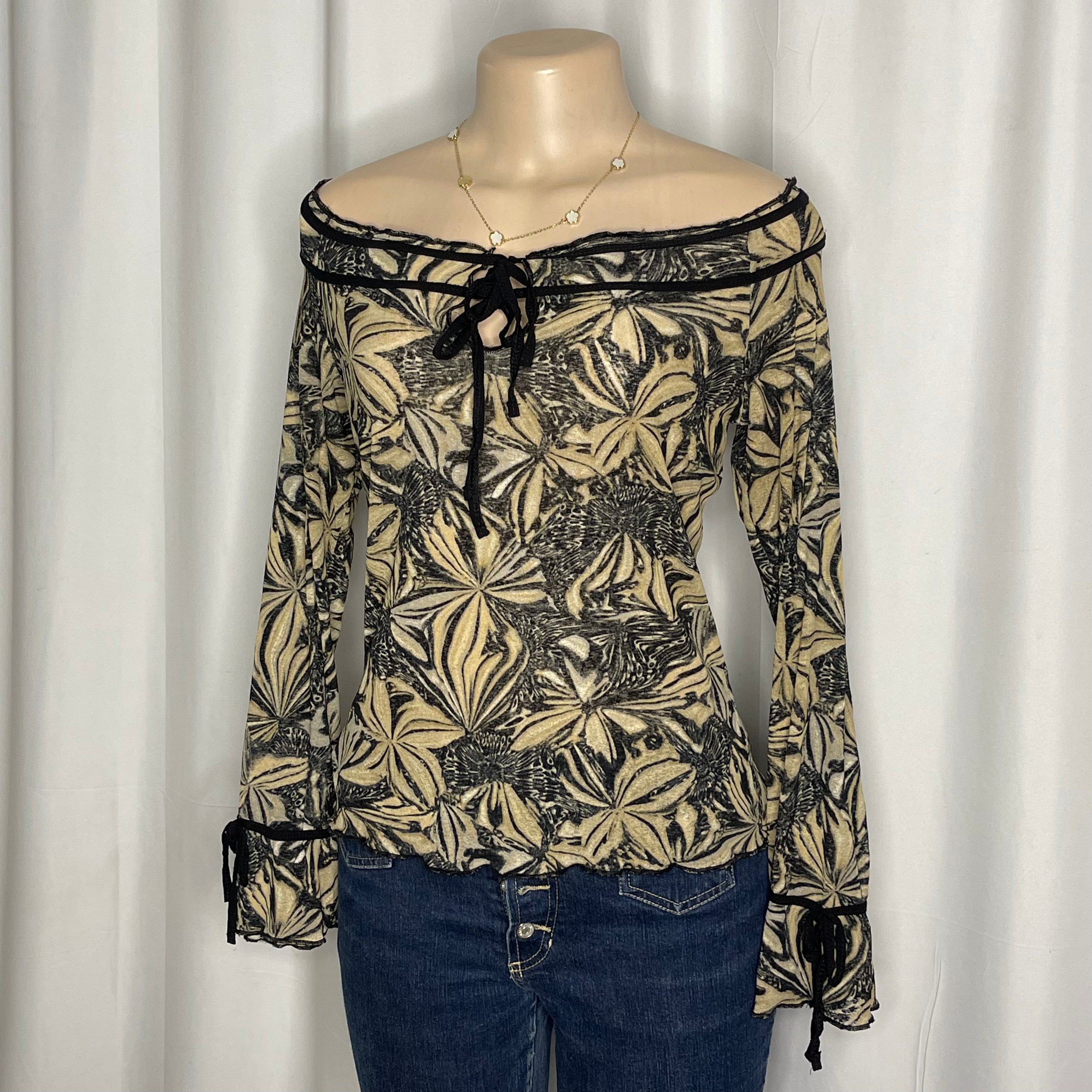 Y2K-style off the shoulder mesh blouse, abstract floral print with front tie neckline and trumpet/bell sleeves