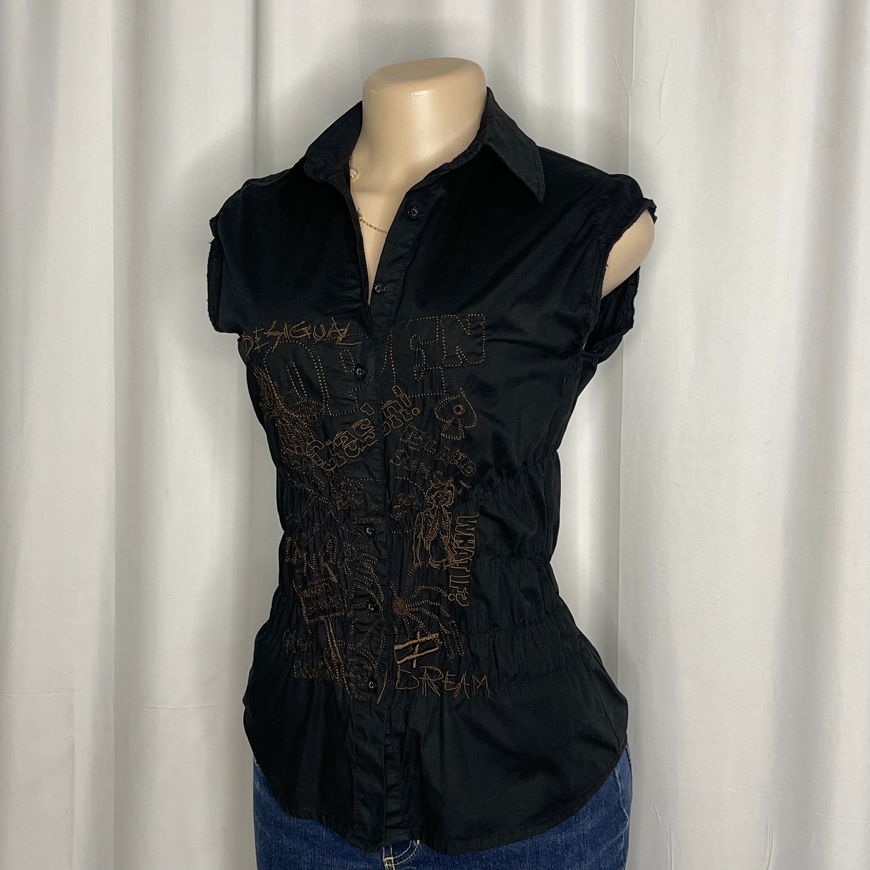 Sleeveless cotton shirt featuring artistic embroidered tee and graphic designs