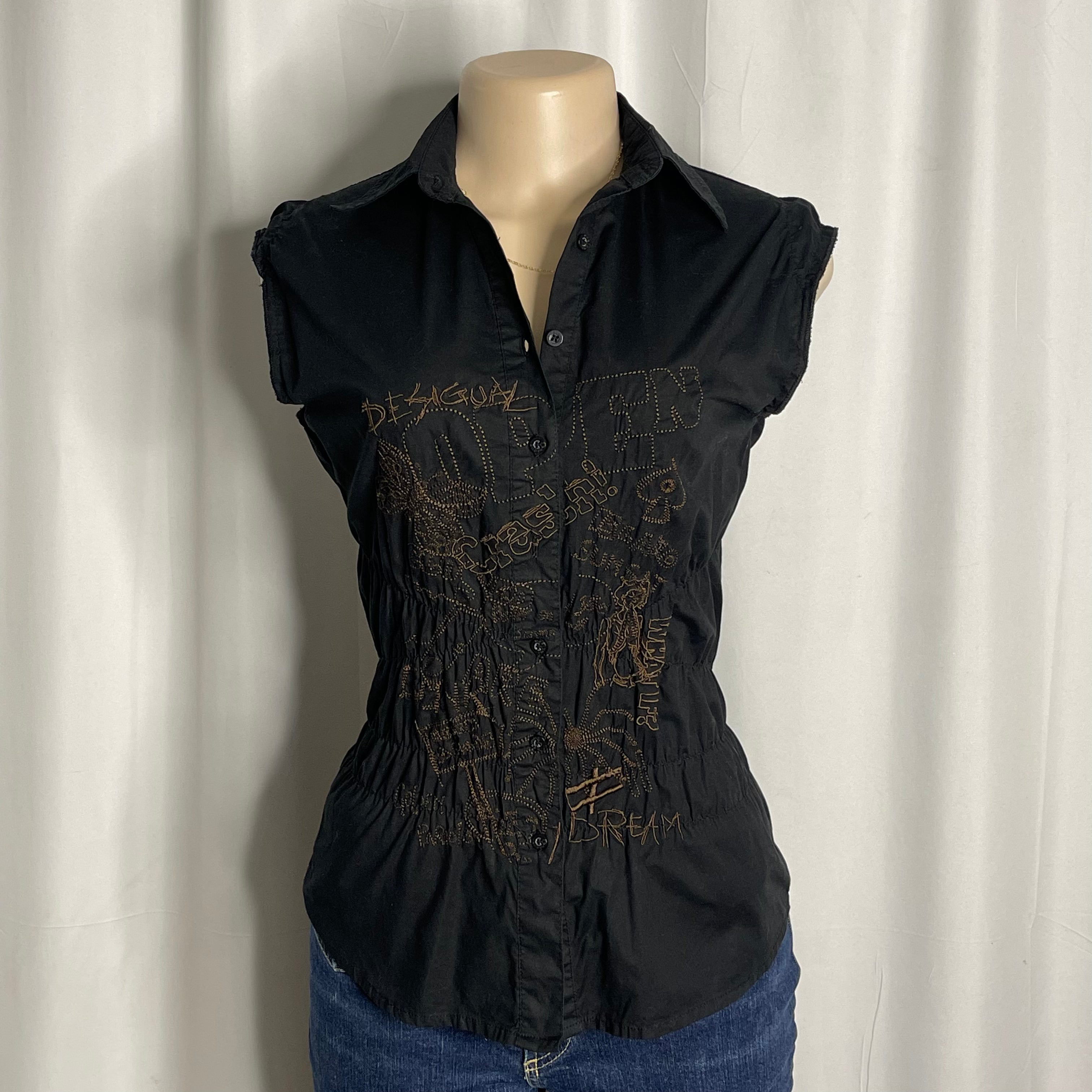 Sleeveless cotton shirt featuring artistic embroidered tee and graphic designs