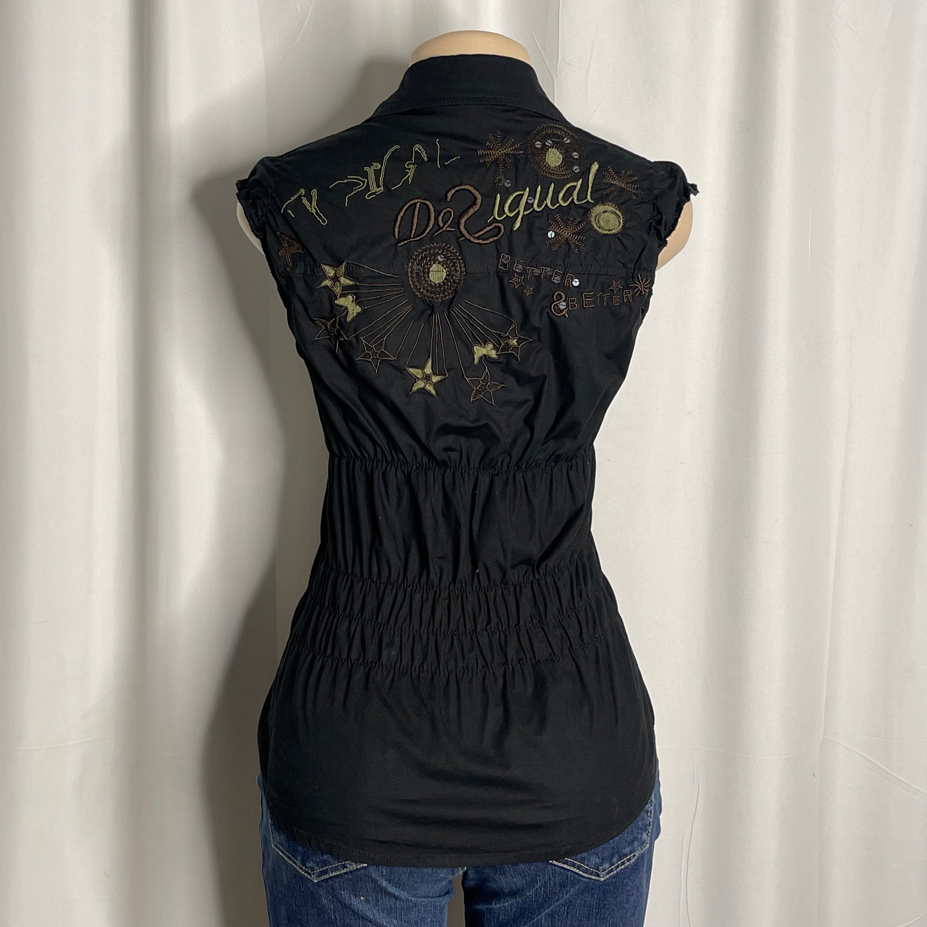 Sleeveless cotton shirt featuring artistic embroidered tee and graphic designs