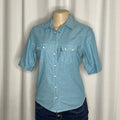 Light blue cotton shirt with a pearl snap buttons