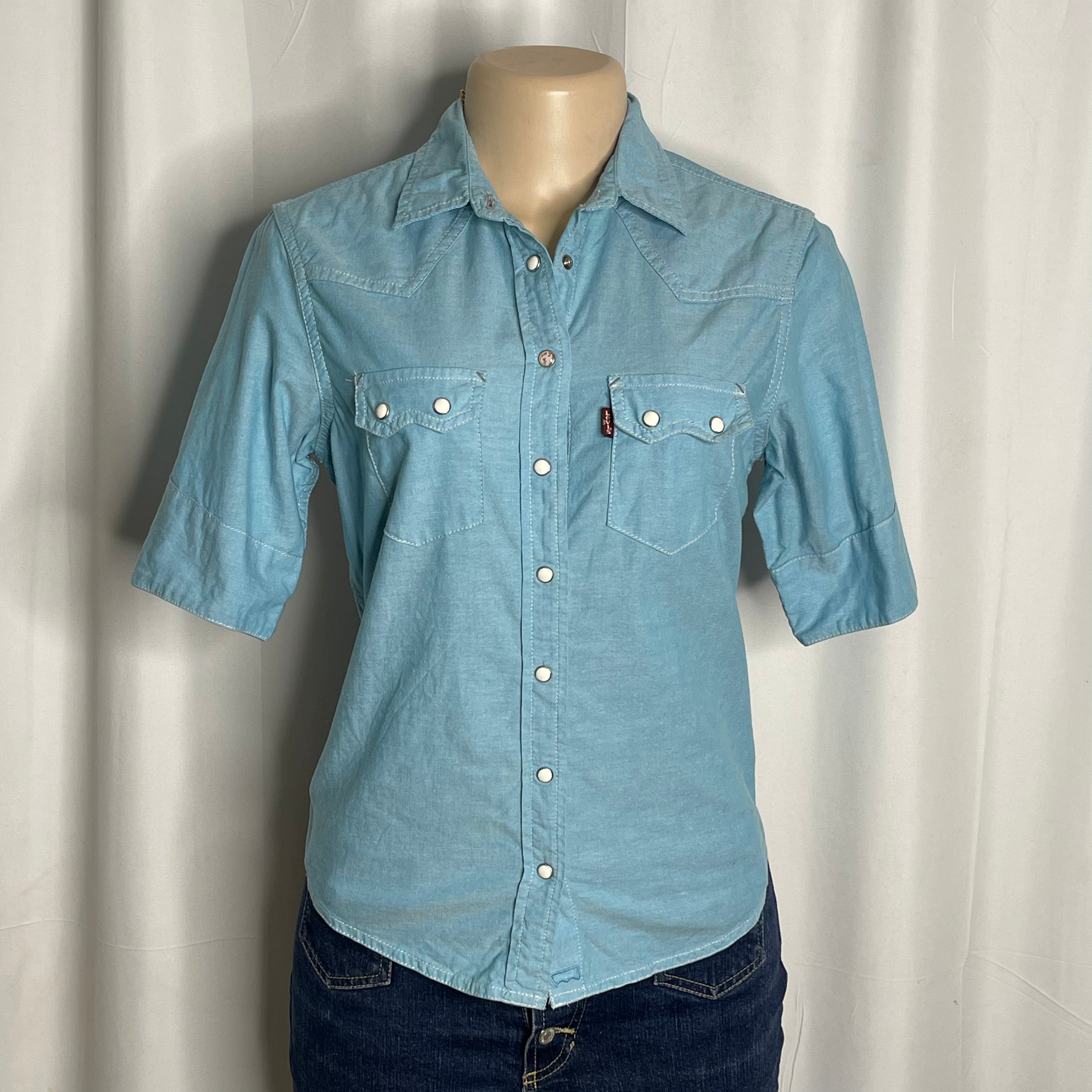 Light blue cotton shirt with a pearl snap buttons