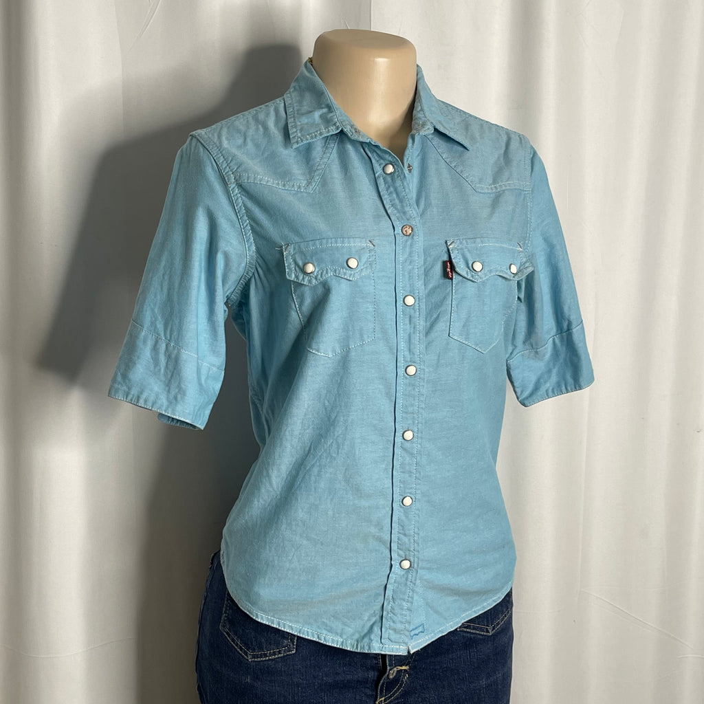 Light blue cotton shirt with a pearl snap buttons