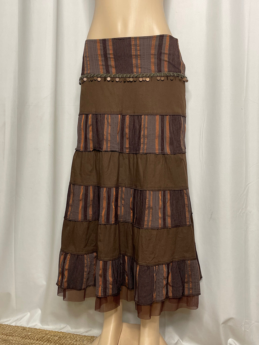 Brown and orange striped tiered maxi skirt with coin embellishments