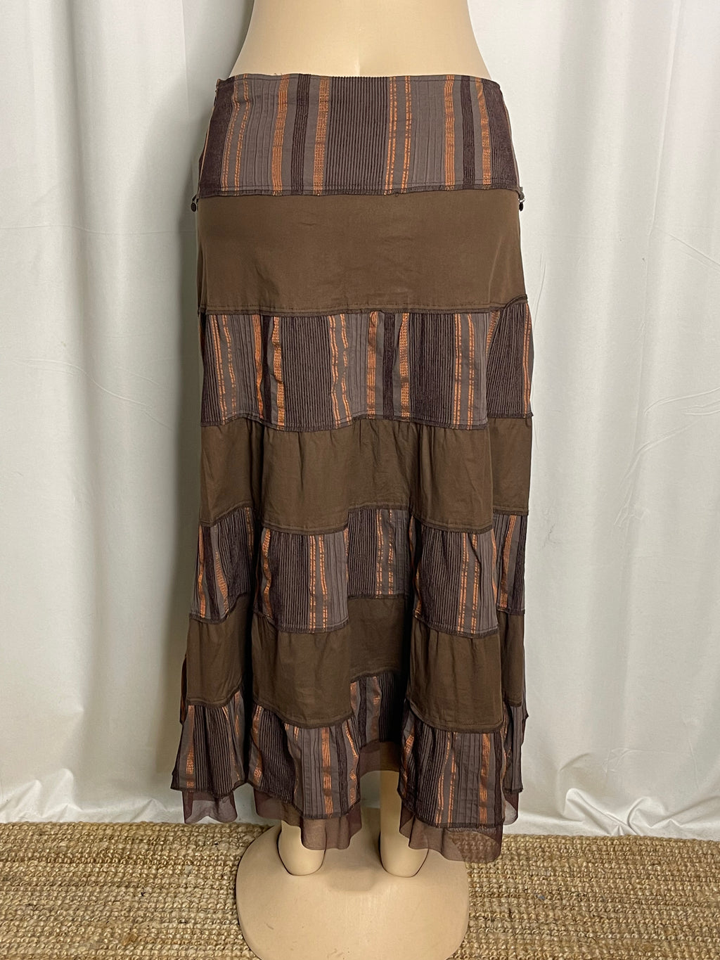 Brown and orange striped tiered maxi skirt with coin embellishments
